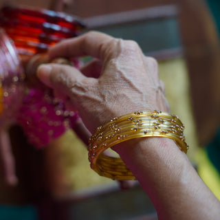 Amaltas | Golden Stone Studded Glass Bangles (Set of 12) | Kanchan 2024
