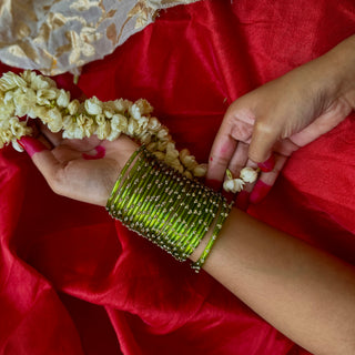 Sukusum | Green Stone Studded Glass Bangles (Set of 12) | Kanchan 2024