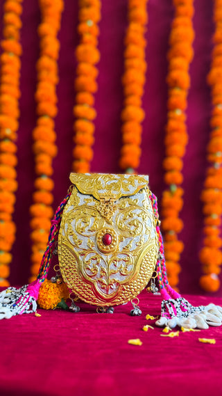 The Phoolwari Brass Clutch | Handcrafted Gold-Silver Bag with Tribal Hangings