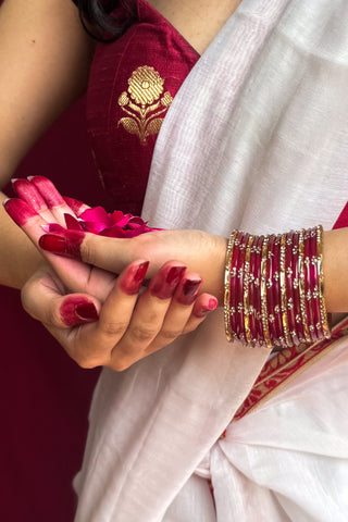 The Gulabi Kirnein | Deep Pink Stone Studded Bangles with Golden Bangles
