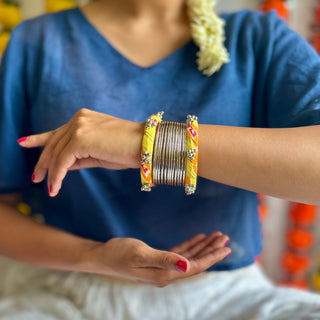 Peele Ghungroo & Silver Bangle Stack (Set of 14)  | JanpathOnline Fabric Jewellery Drop August '24