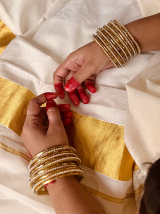 Amaltas aur Moti Stack | Golden Stone Studded Bangles & Moti Bangles